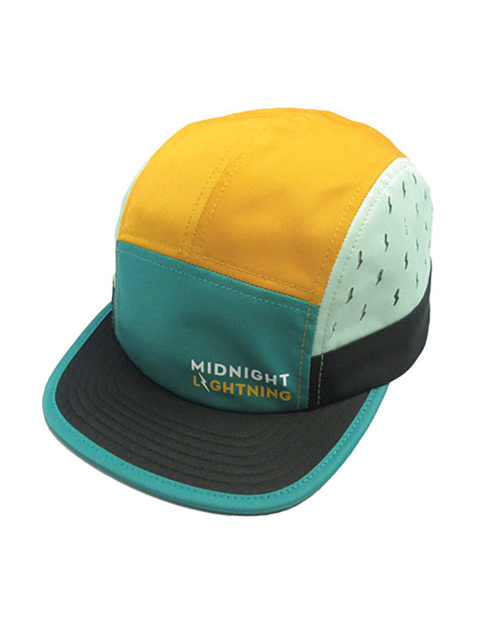 Approach Hat in the "Team" colorway by Midnight Lightning with Midnight Lightning text at front. Main panels in teal, mustard, black, and white with black dots/small lightning bolt patterns. Black brim with teal trim.