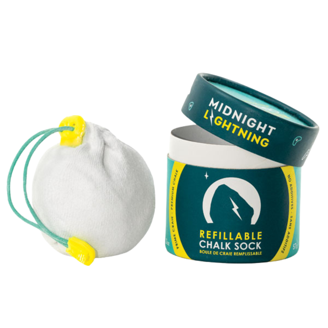 A cylindrical container labeled "Packaged Chalk Sock by Midnight Lightning" holds a refillable chalk sock, used for climbing or gym activities. The sock is white with yellow and teal pull strings. The container's design includes a lightning bolt symbol and teal and yellow color scheme.