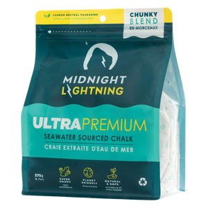 A package of Midnight Lightning Chunky Chalk. The eco-responsible packaging is dark blue and teal with white text, showing product features: seawater sourced, super grippy, planet friendly, and natural & safe. The top right corner indicates it is a "Chunky Blend".